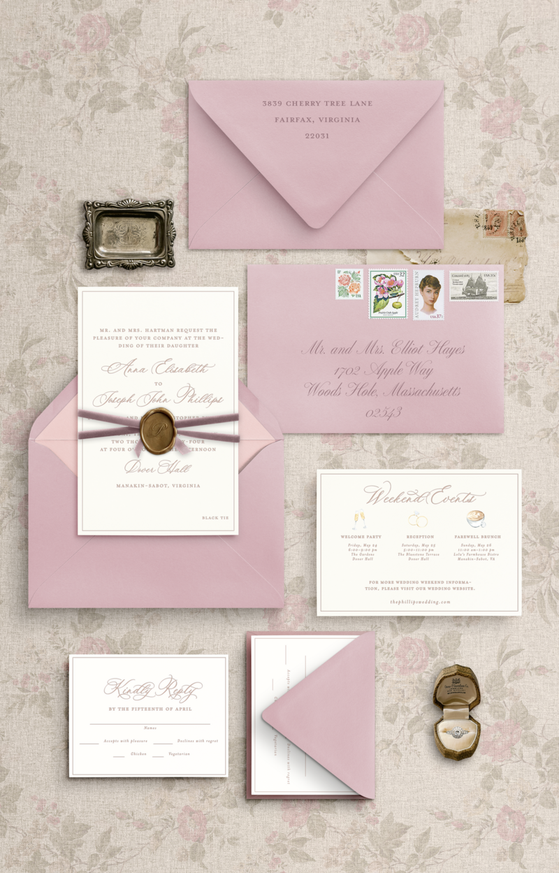 Pink envelopes with a details card, invitation card, rsvp card and envelope, wax seal, and velvet ribbon.
