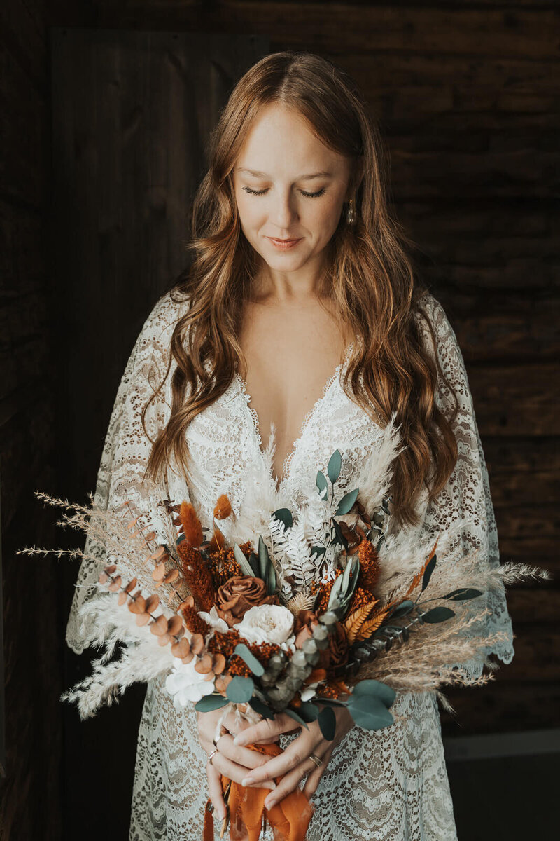Wedding boho bride with large wedding flowers