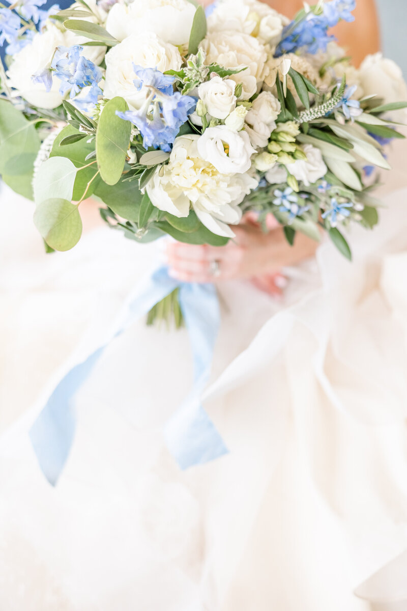 luxury wedding bouquet with blue flowers and soft ribbon