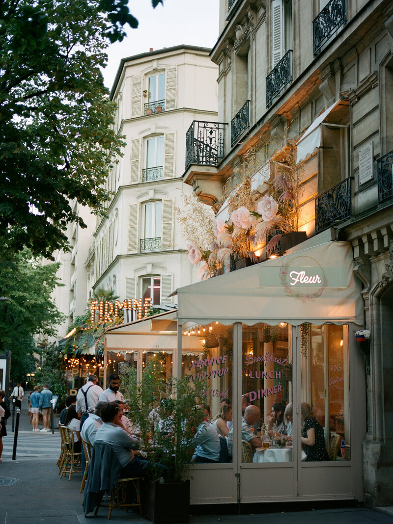 people dine outside on patio in paris