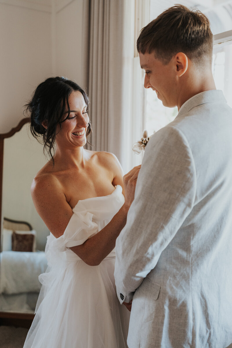 Bride and groom getting ready together