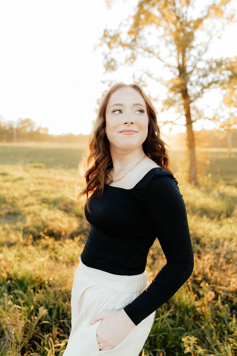 girl posing with hands in pockets