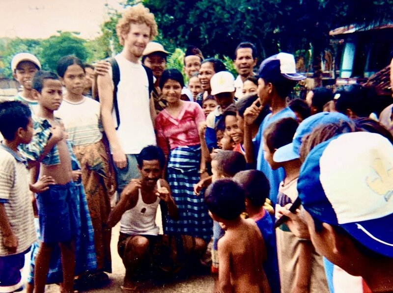 Daniel among a group during a cultural exchange