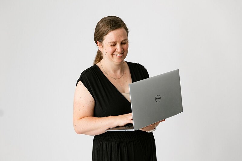 Close up of womans using black laptop