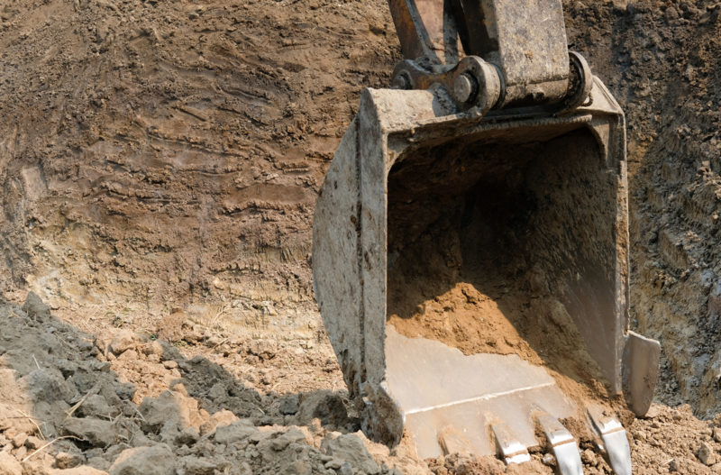 excavating property for drain tile