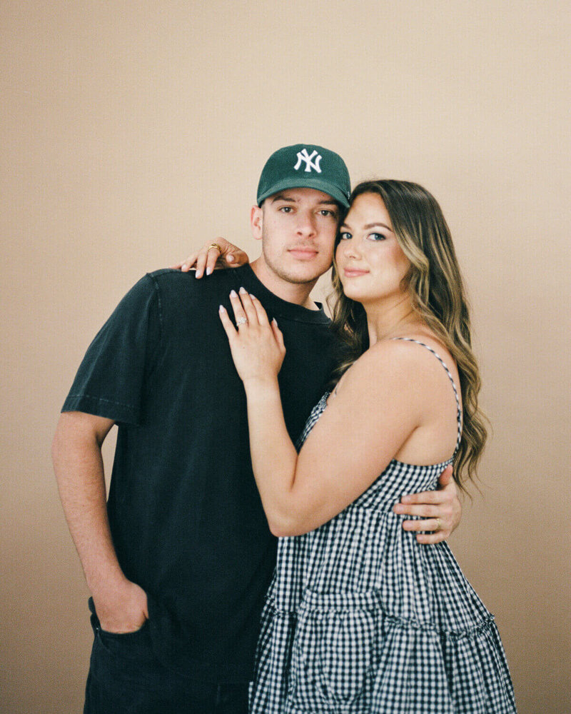 husband and wife fort myers florida photographers posing in studio