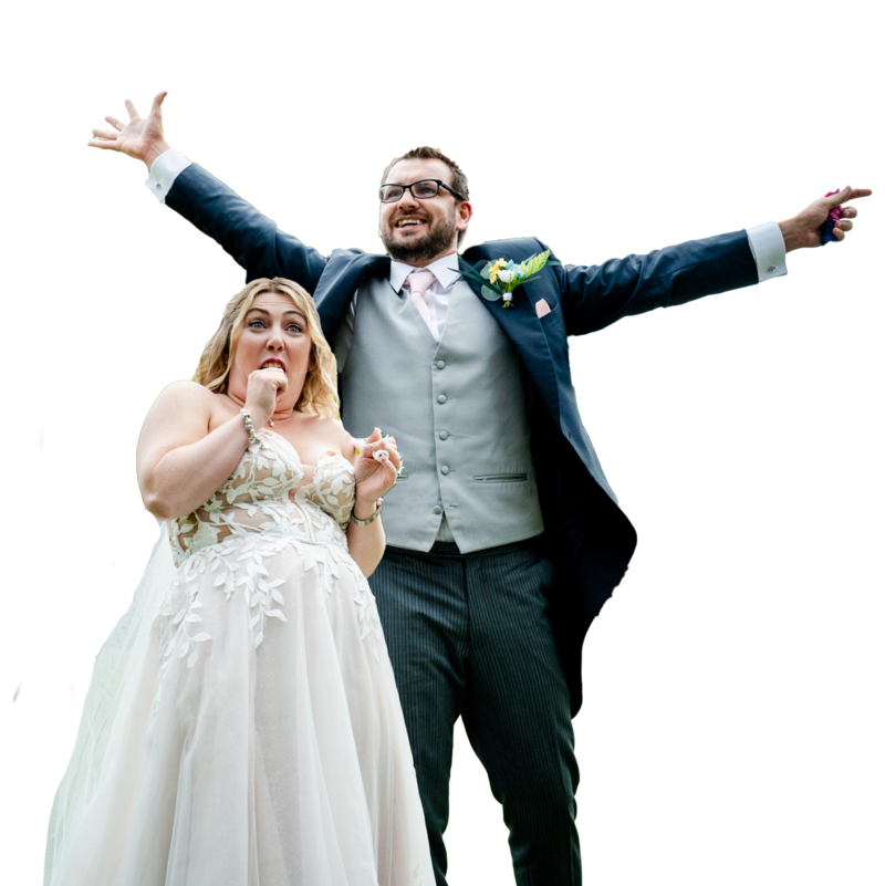 the coolest wedding couple who just got married at clearwell castle - she is in disbelief, he is super happy with arms aloft