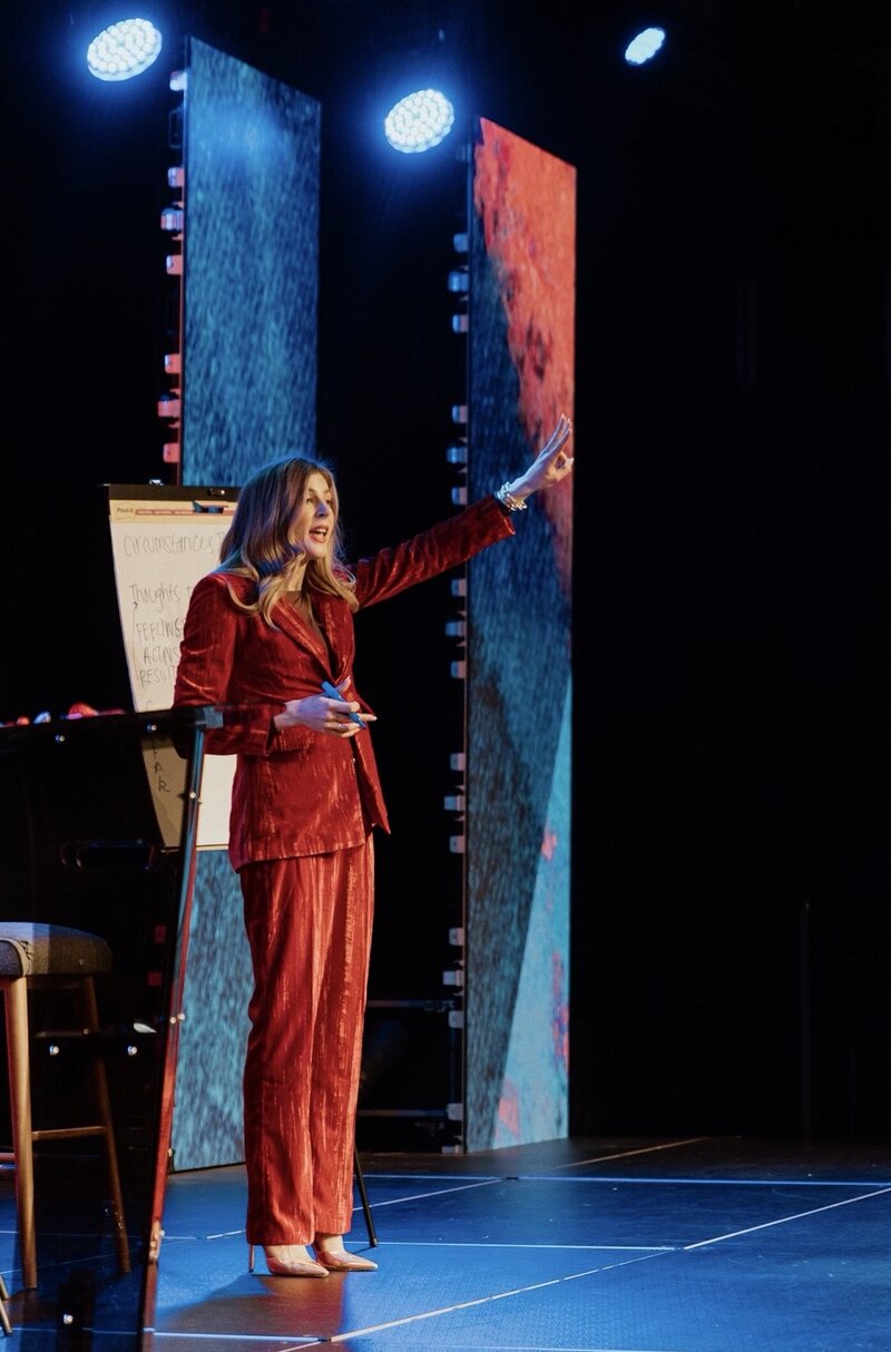Macy McNeely speaking on stage