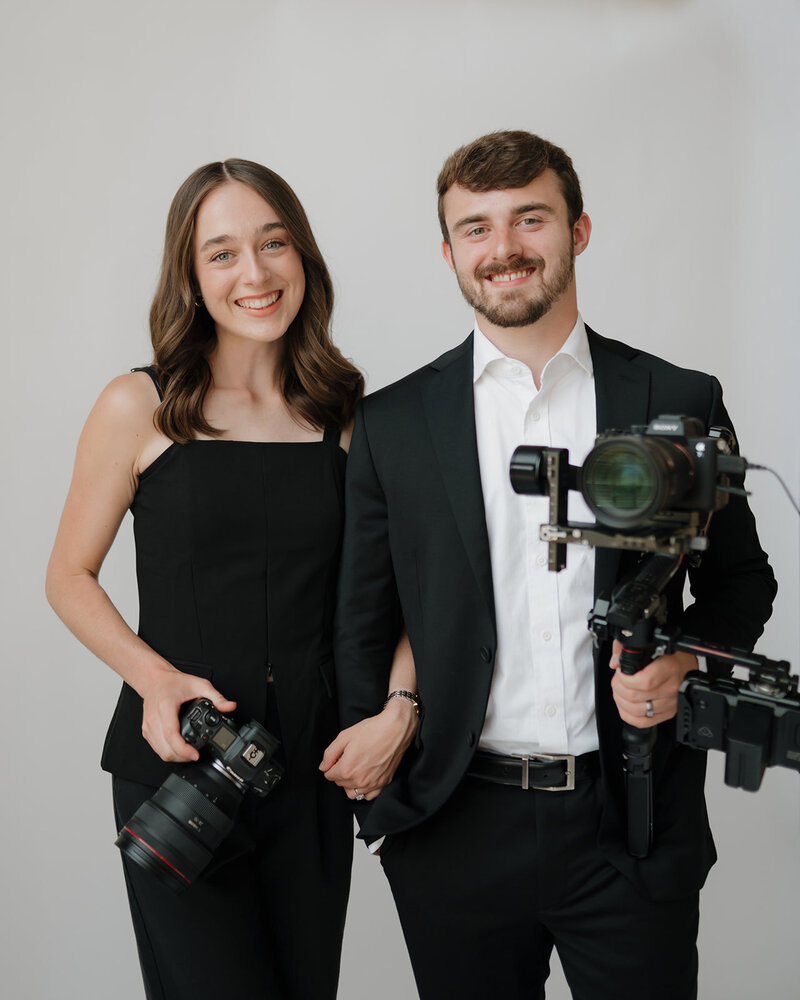 photographers smile at each other