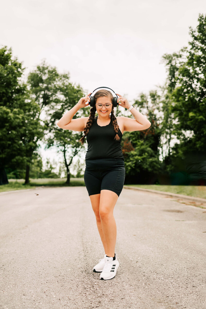girl walking street in workout gear