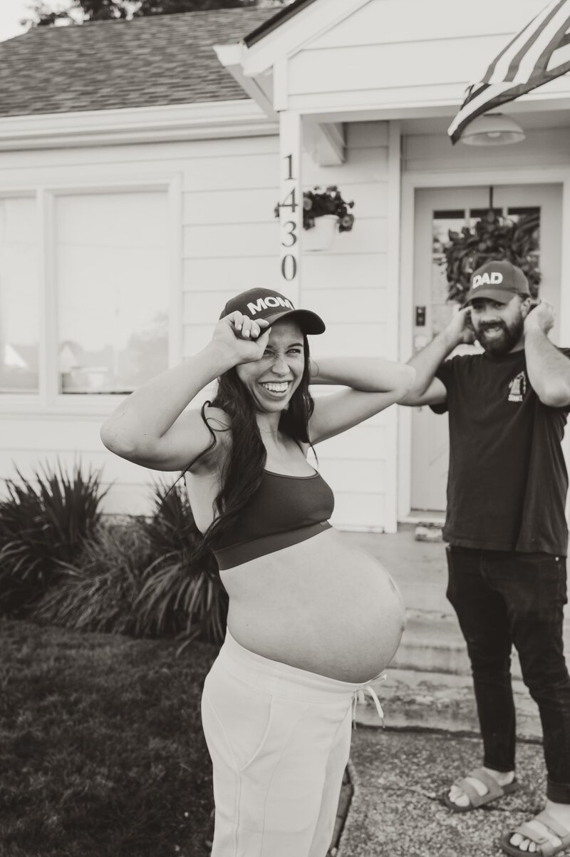 maternity photo in front of house