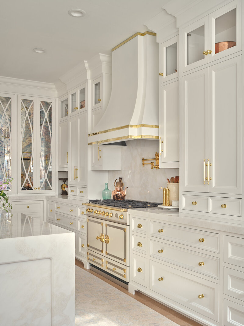 white luxury kitchen with gold accents and CornuFé  stove,