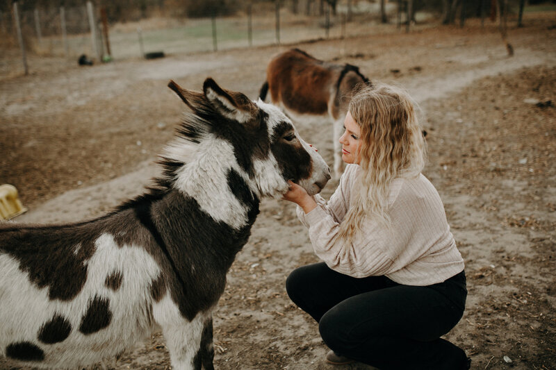 Owner Chasity cares for a donkey