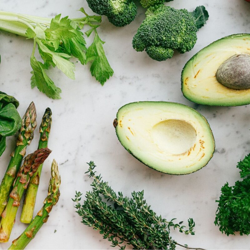 Assorted green vegetables, including asparagus, broccoli, avocado, and more.