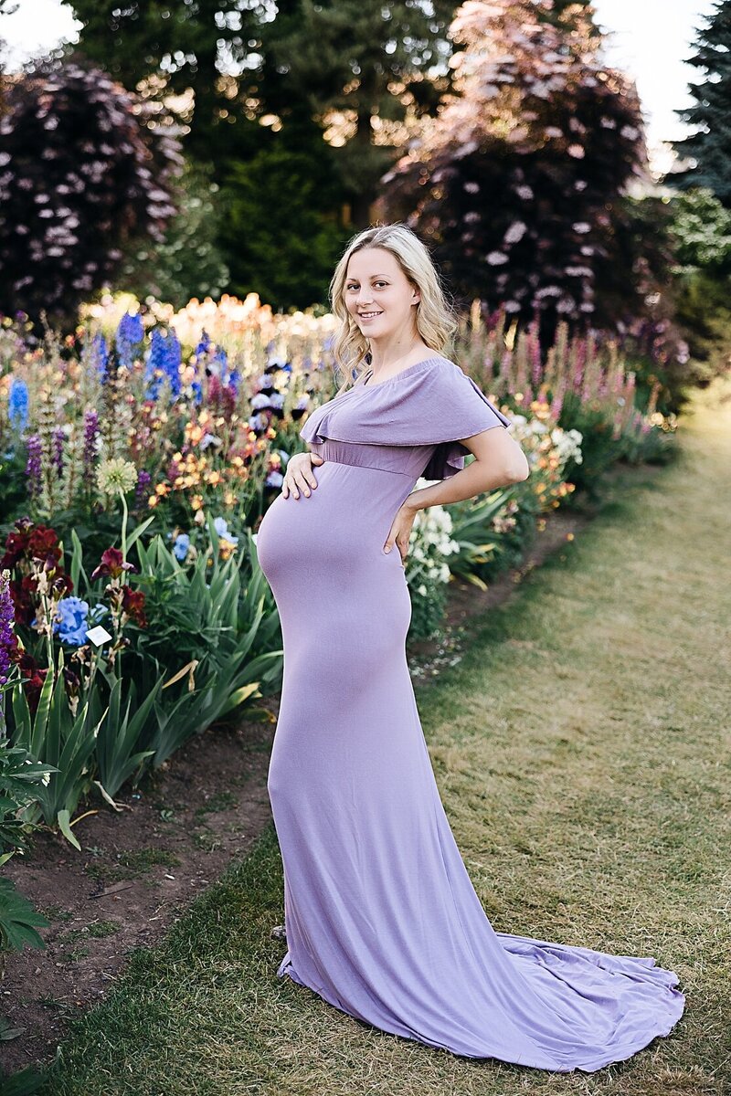 Expectant mother in white dress in lavender field