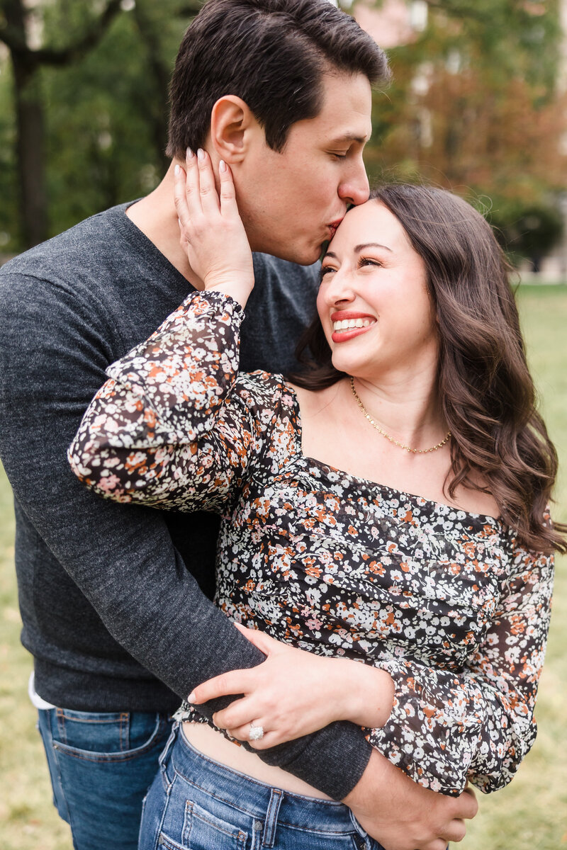Couple laugh together during their engagement session in Austin, Texas. Photo taken by Austin Engagement Photographers, Joanna & Brett Photography