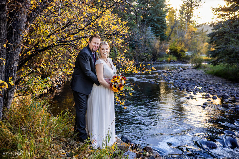 Wedding Photo by the River During Fall at Romantic Riversong Inn Estes Park Colorado