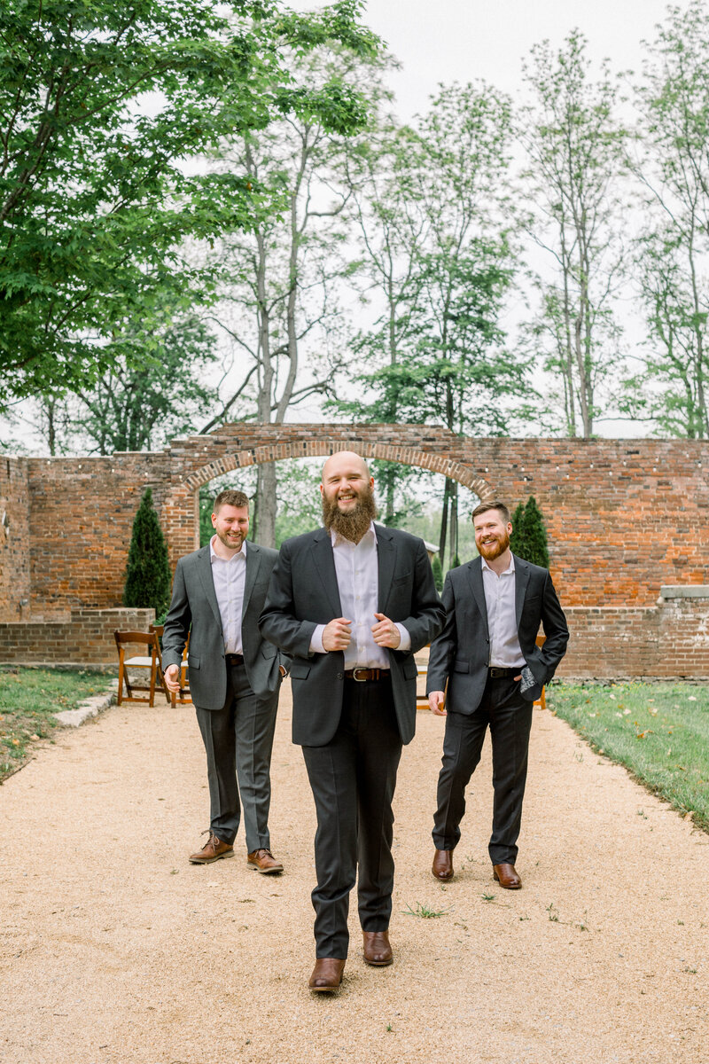 groom walking with his groomsmen
