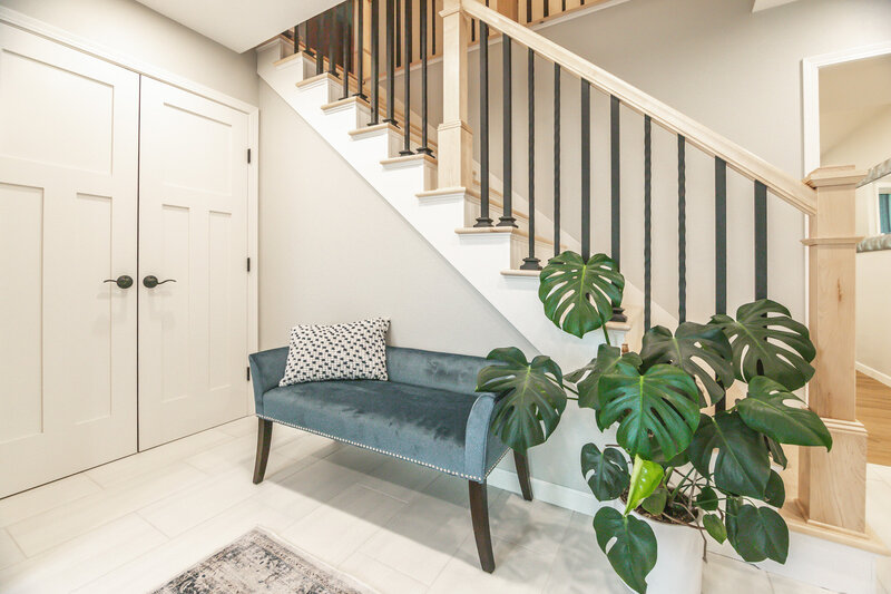 staircase with cozy loveseat