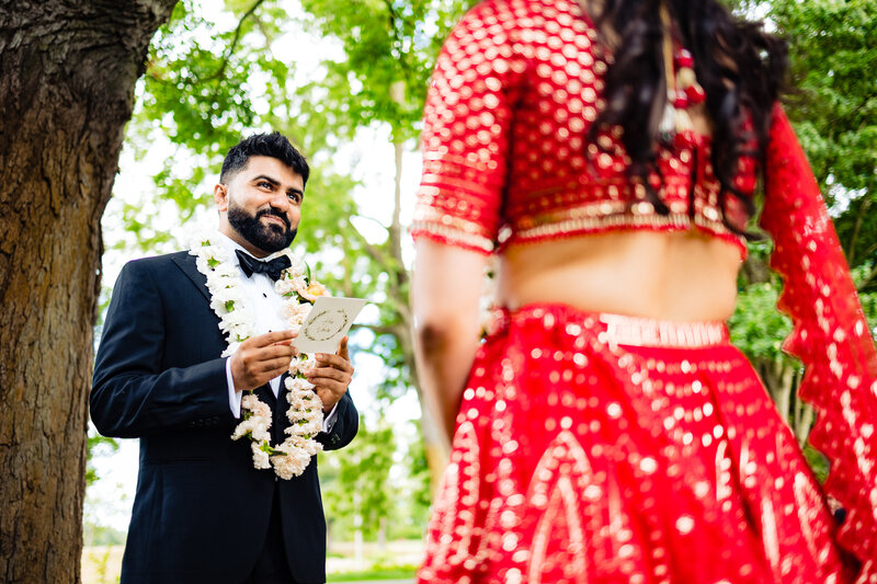 A Indian groom reading his vows to the bride during a ceremony in Toledo Ohio