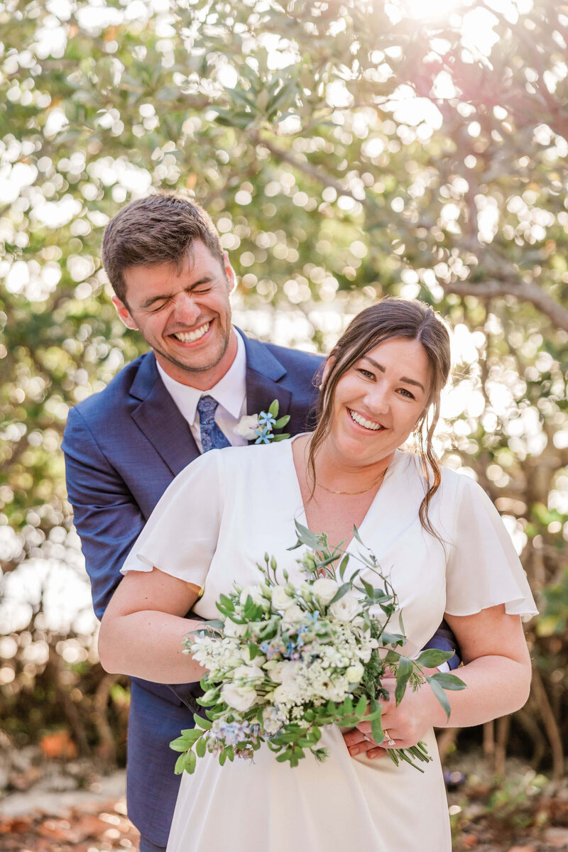 A candid moment between the bride and groom at Abercrombie Park in St. Pete, showcasing their connection and happiness.