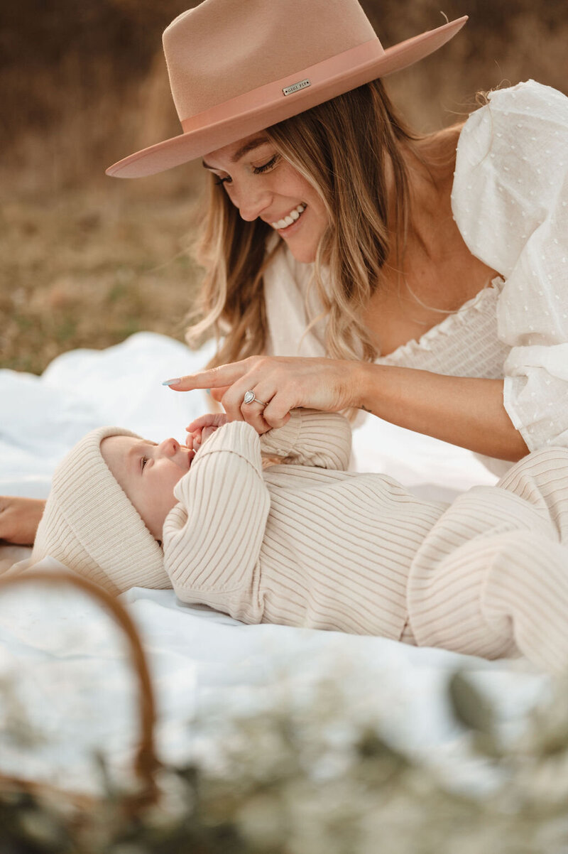 Mother and daughter enjoying a picnic during a photo session in Doylestown, Pennsylvania