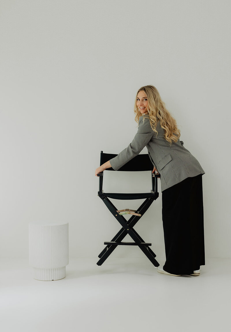 a makeup artist setting up directors chair and table