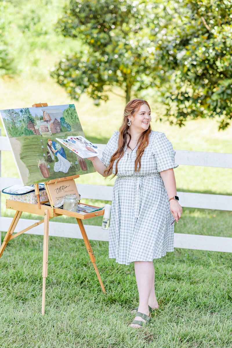 Artist painting live wedding scene outdoors, immersed in capturing a special moment for the painting
