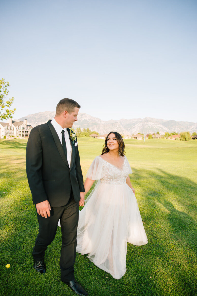 Jackson Hole wedding photographers capture bride and groom walking together after Jackson hole wedding