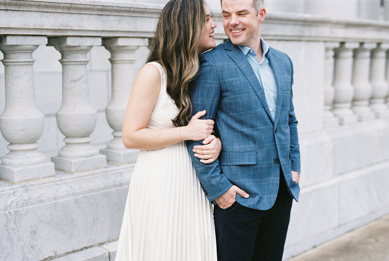 A couple holds each other in front of white columns by Chattanooga wedding photographer Kelsey Dawn Photography