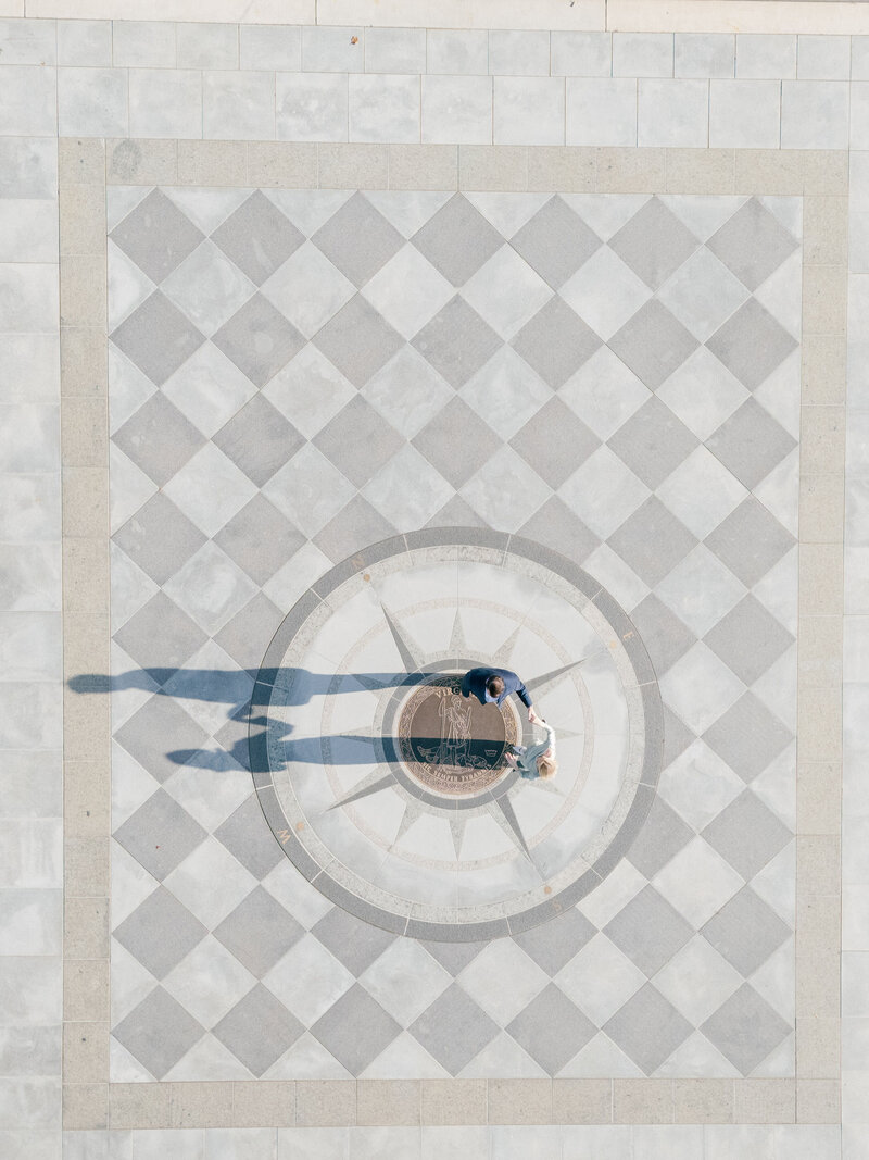 an aerial view of a bride and groom dancing 