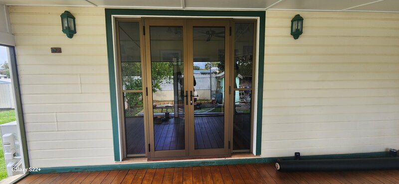 Modern aluminium-framed sliding glass doors, designed for security and energy efficiency in residential spaces.