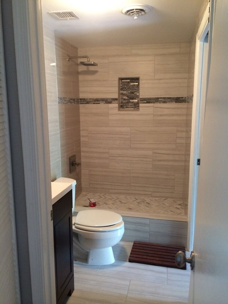 bathroom remodel atlanta with shower, toilet, and tiling