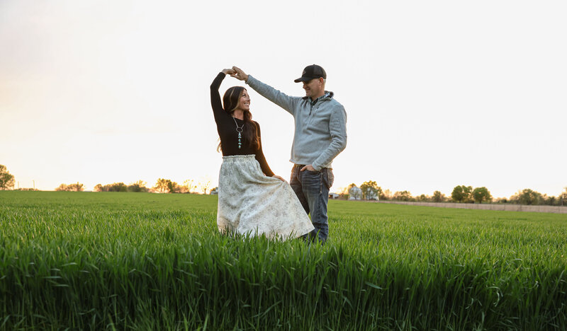Couple dancing in a field of grass