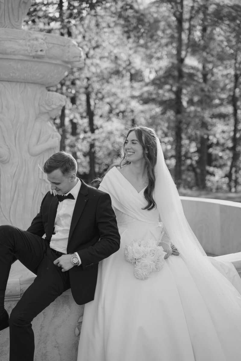 Bridal photos at the fountain at Glasshouse on enchanted Acres