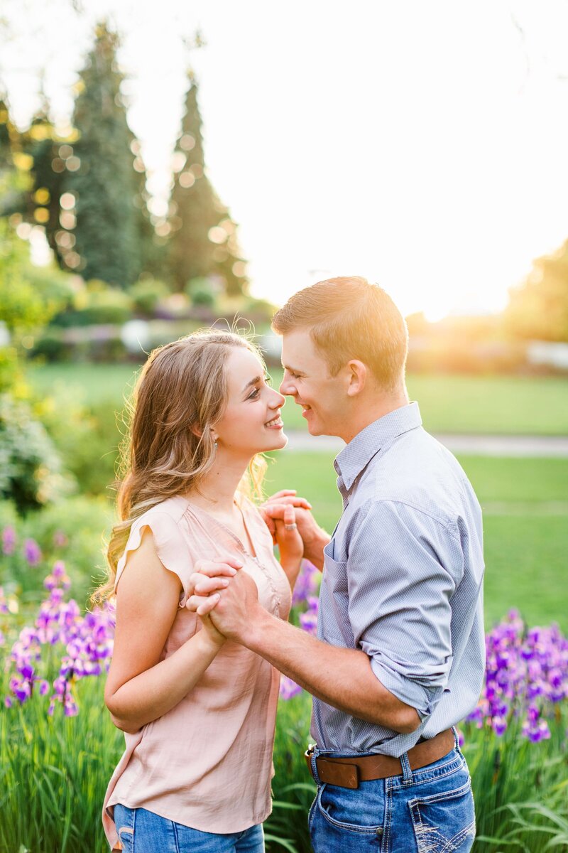 Couple kisses in the flowers at Manito Park Spokane