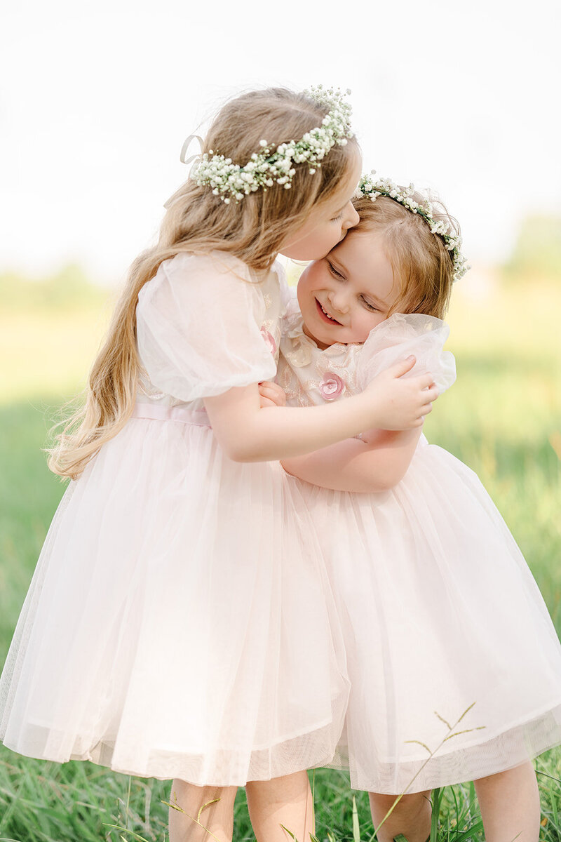 Mother and sun embrace during a morning family photo session.