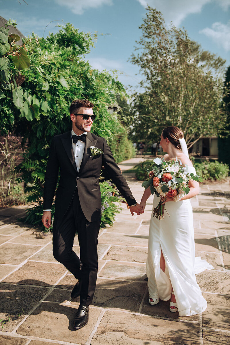 Bride and groom walking in luxury wedding venue