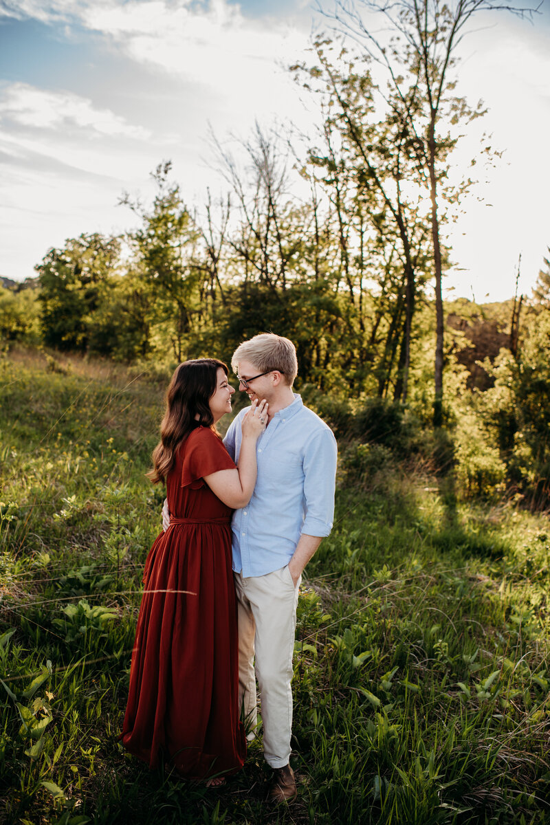 Man and woman embracing each other for their engagement session in Waukesha, WI