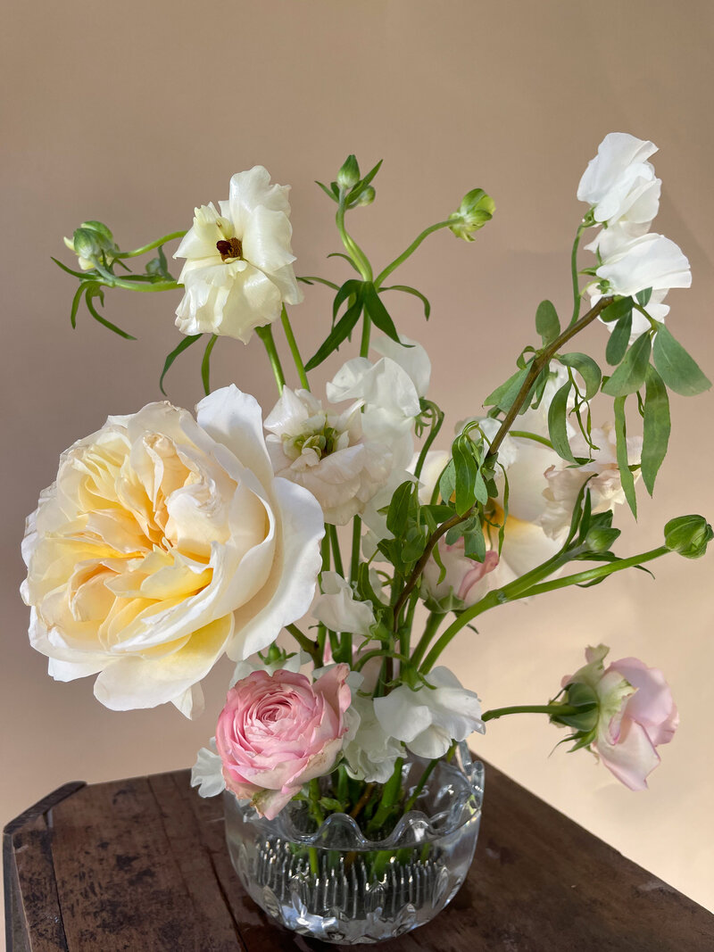 Eugenie rose, butterfly ranunculus, and sweet pea ikebana arrangement