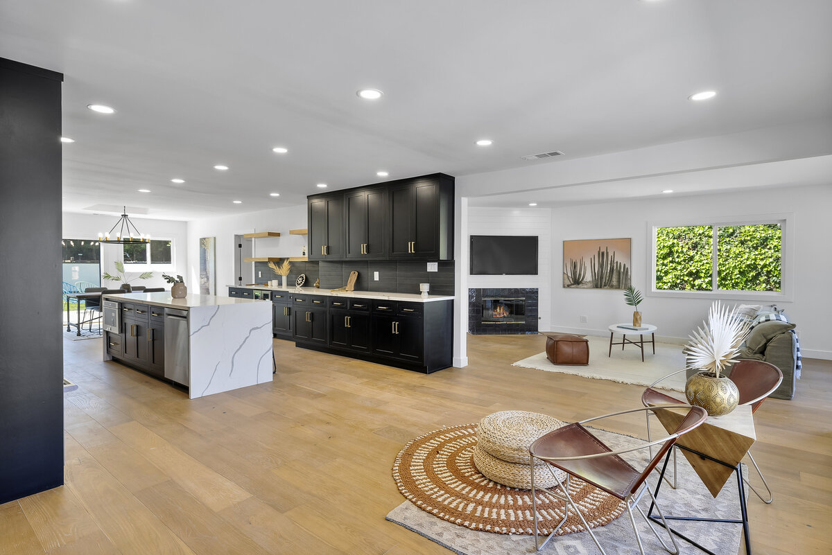Matte black kitchen open to the living room