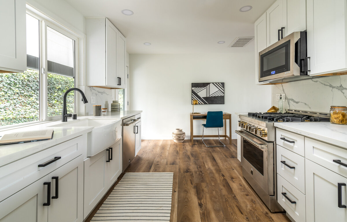 White cabinets with marble backsplash