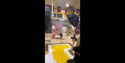 Greensburg Salem Girls basketball team picture day in the gym with fog machine and colored gel lights.