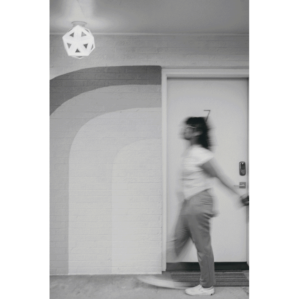 woman walking while holding a camera