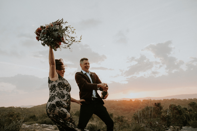 Fun gif of a couple popping and spraying champagne on their Elopement in Central Coast NSW