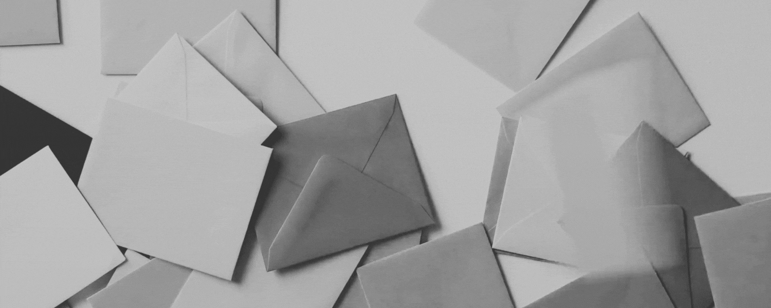 Envelopes falling in the background with client message about pushing the envelope with graphic and website design with Amanda Newman Design