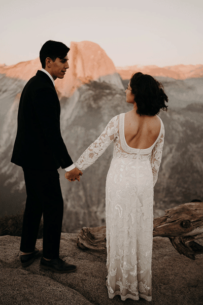 moving GIF of a bride and groom kissing in front of the Yosemite dome