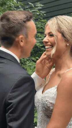 Ohio bride giggling after getting a peck from her groom.