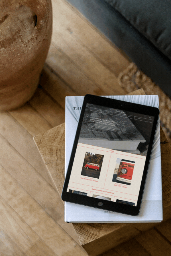 gif of a showit website displayed on an ipad laying on a book with a wooden background