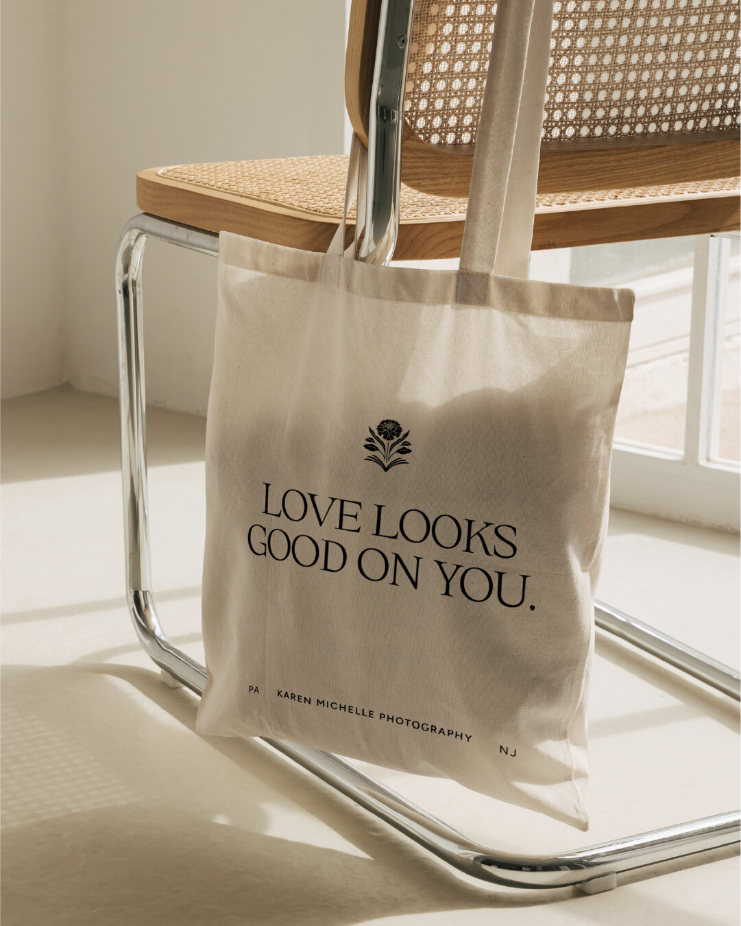 Custom branded tote with Karen Michelle logo and message reflecting warm, joyful wedding photographer identity